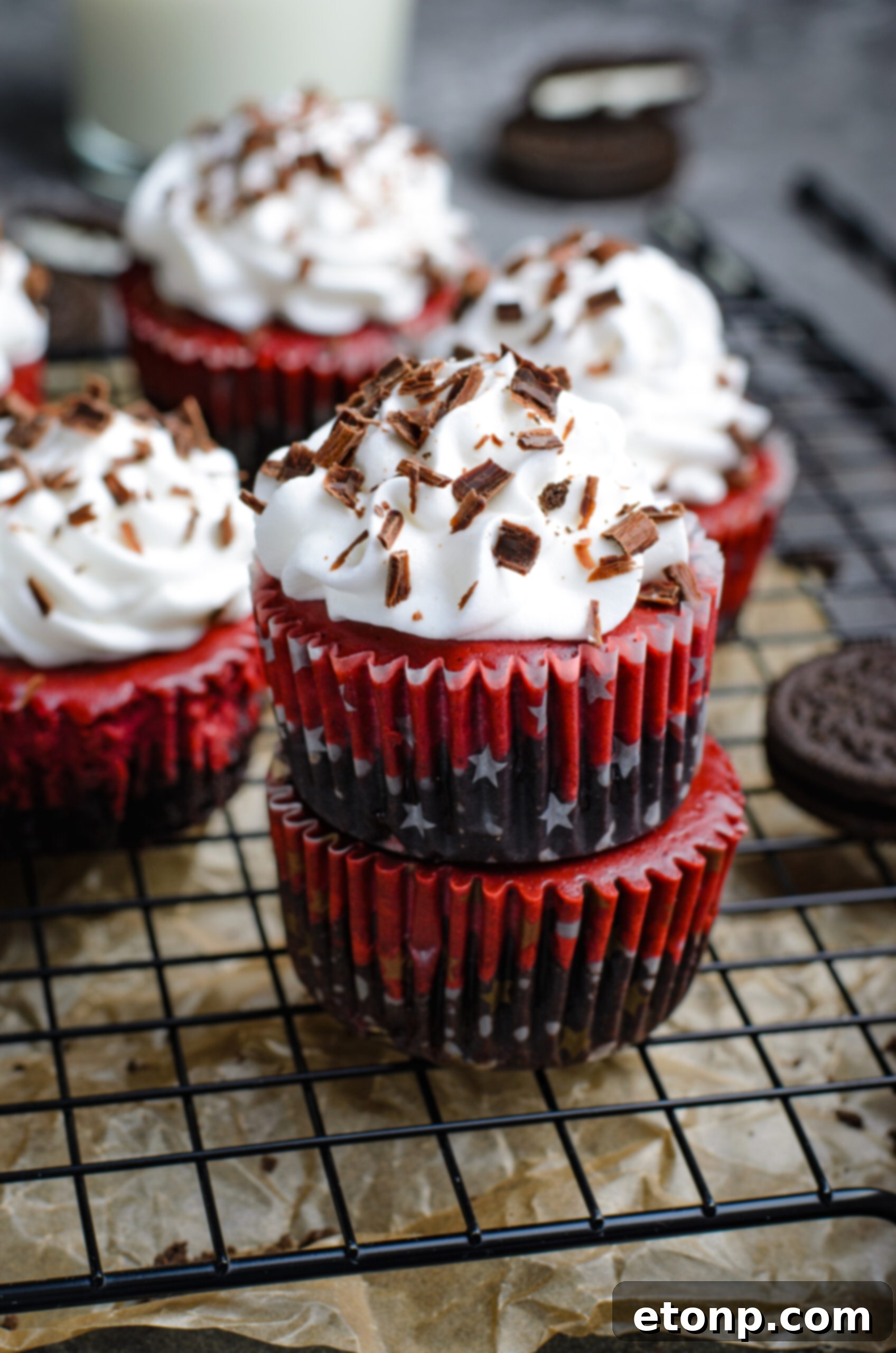 Front view of three Mini Red Velvet Oreo Cheesecakes stacked.