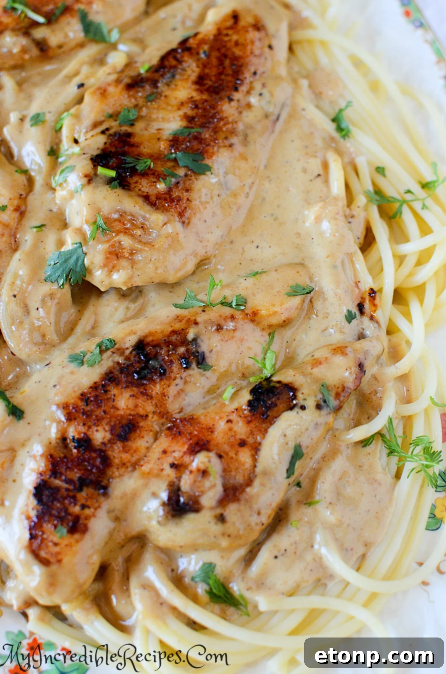 Cook stirring creamy Chicken Lazone sauce