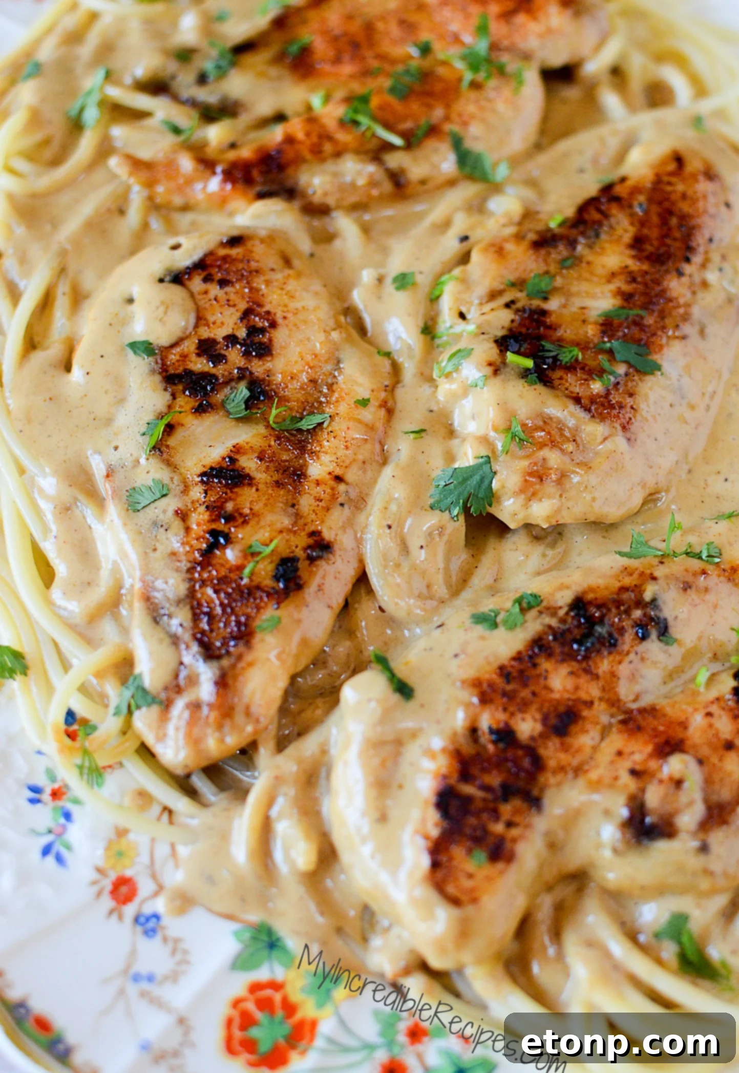 Close-up of chicken breasts browning in a skillet