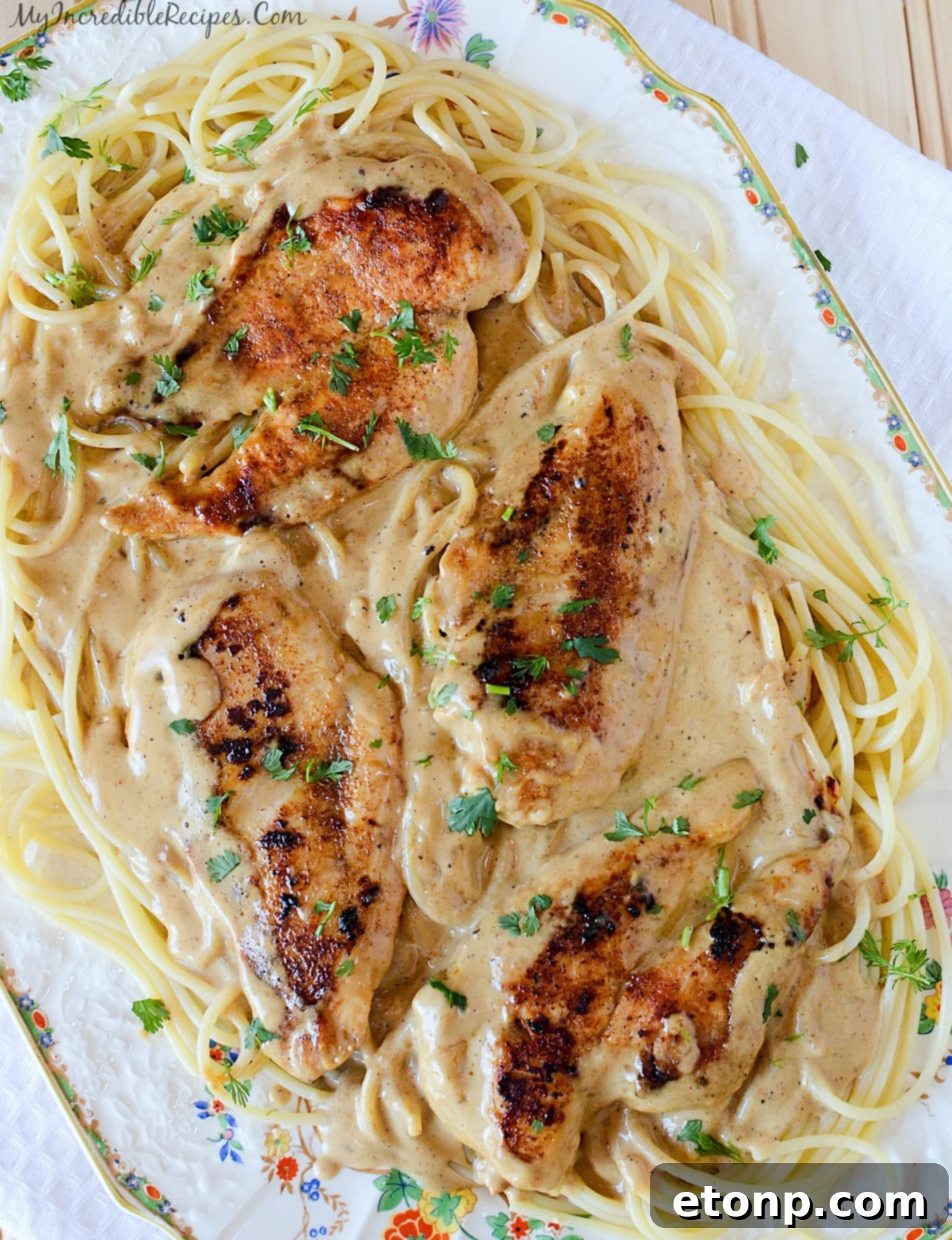 Creamy Chicken Lazone sauce bubbling in a pan