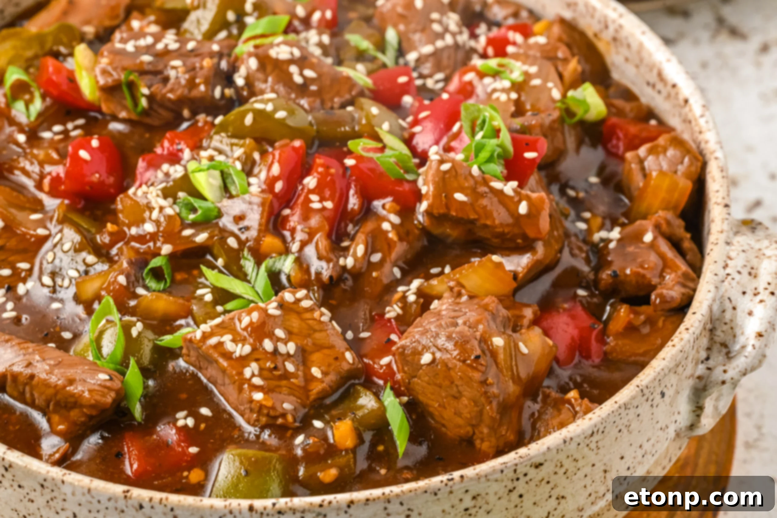 Close up view of Chinese Pepper Steak in a baking dish.