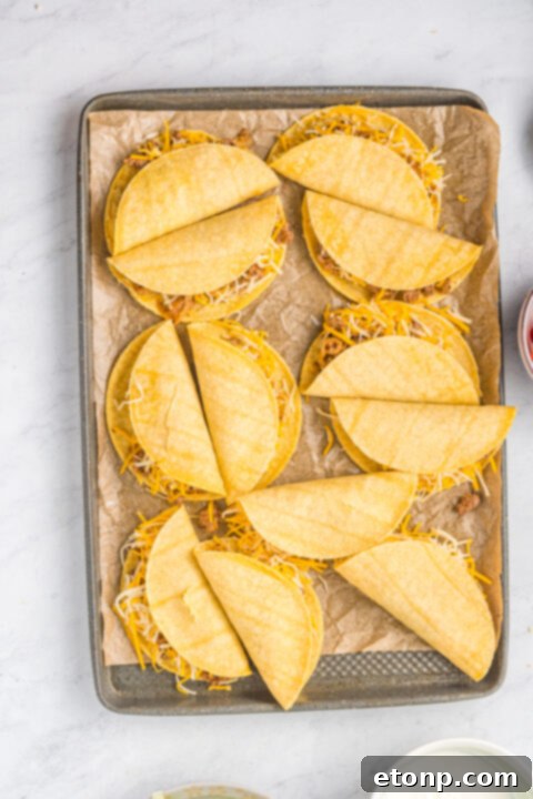 Golden-brown crispy tacos fresh out of the oven.