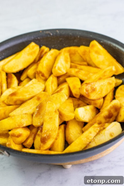 Another perspective of the delicious Cracker Barrel Fried Apples, focusing on the caramelized edges and soft interior.