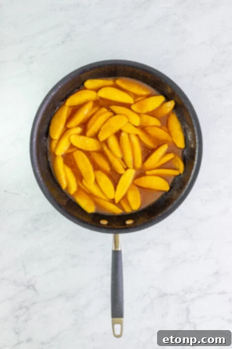A final presentation shot of Cracker Barrel Fried Apples, emphasizing their golden color and mouthwatering appeal.