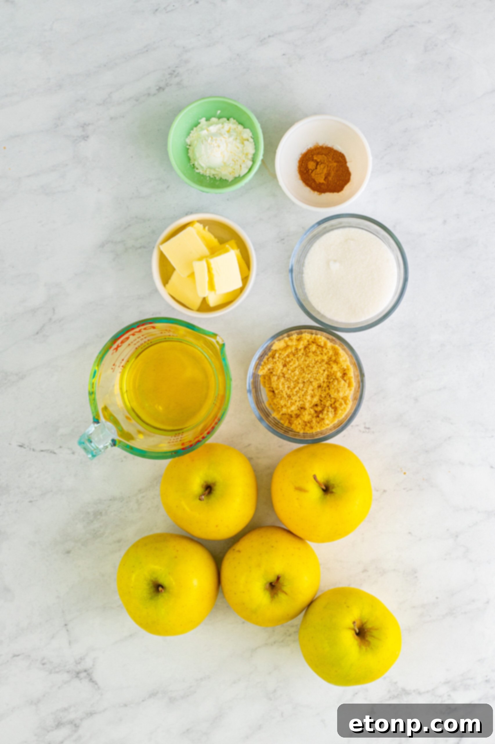 Overhead view of all the fresh, high-quality ingredients neatly arranged, ready for preparing the delicious Cracker Barrel Fried Apples recipe.