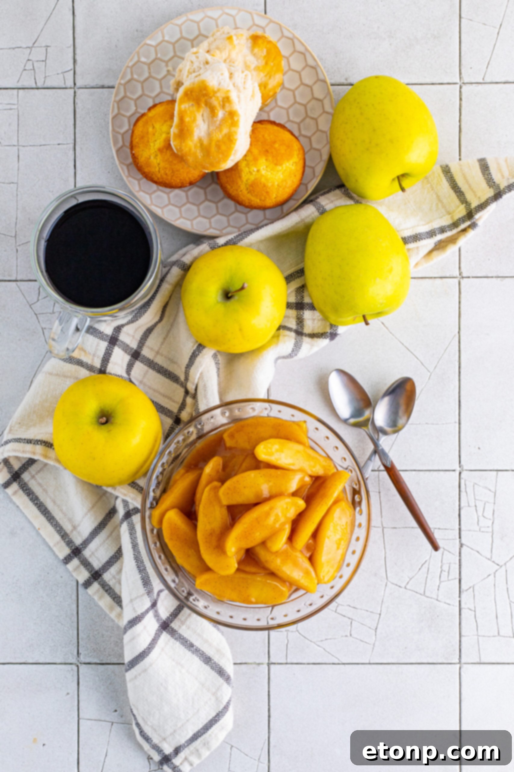 Overhead view of a glass bowl filled with inviting Cracker Barrel Fried Apples, showcasing their perfect glaze and soft texture.