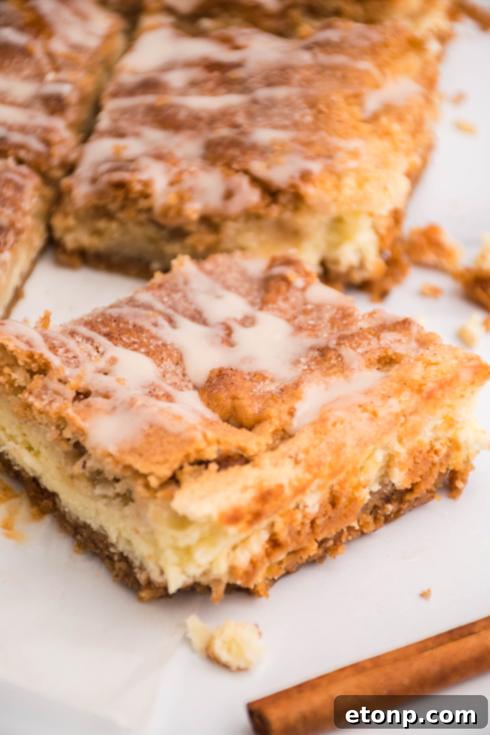 Close up view of a Snickerdoodle Cheesecake Bar.