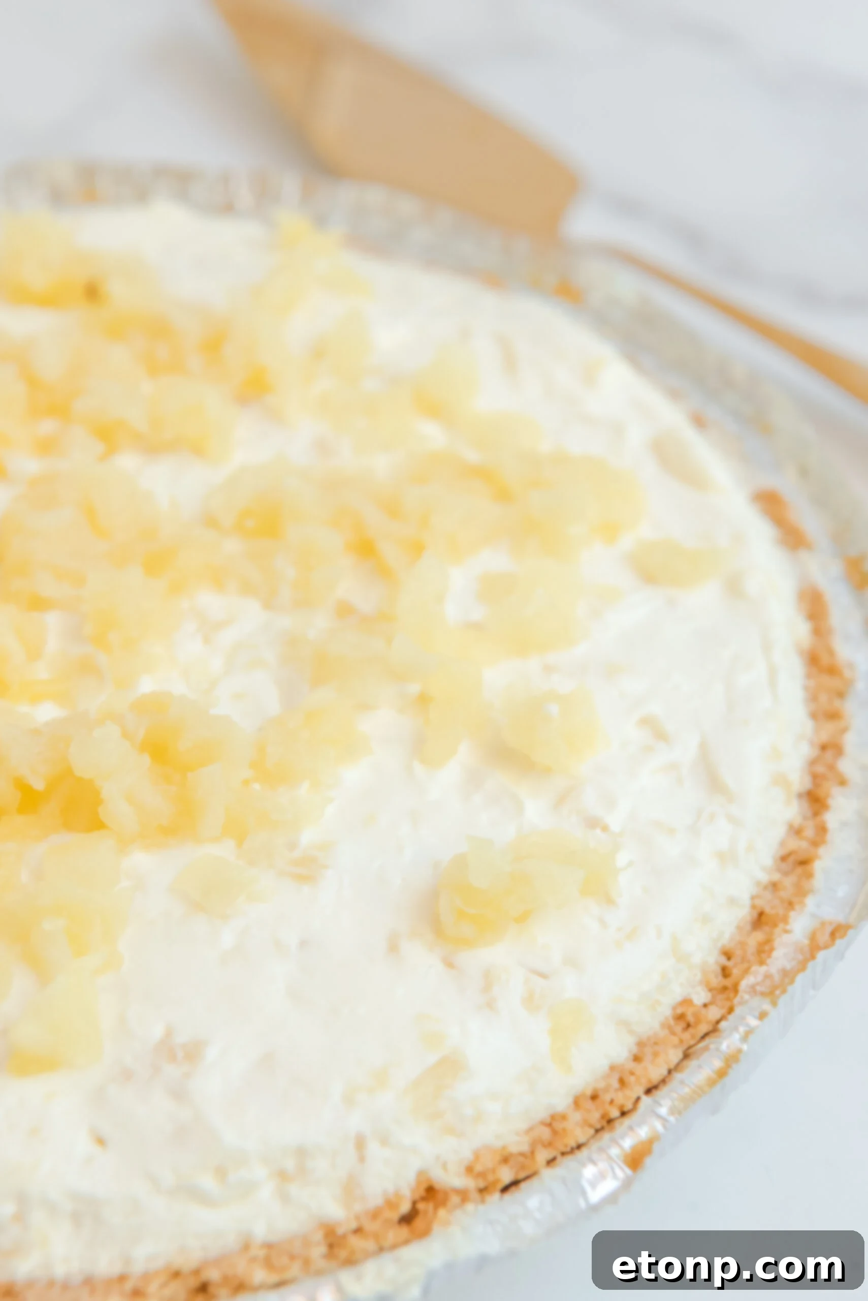 Chilled Pineapple Cheesecake Bliss 3 Close up view of No Bake Pineapple Cheesecake uncut.