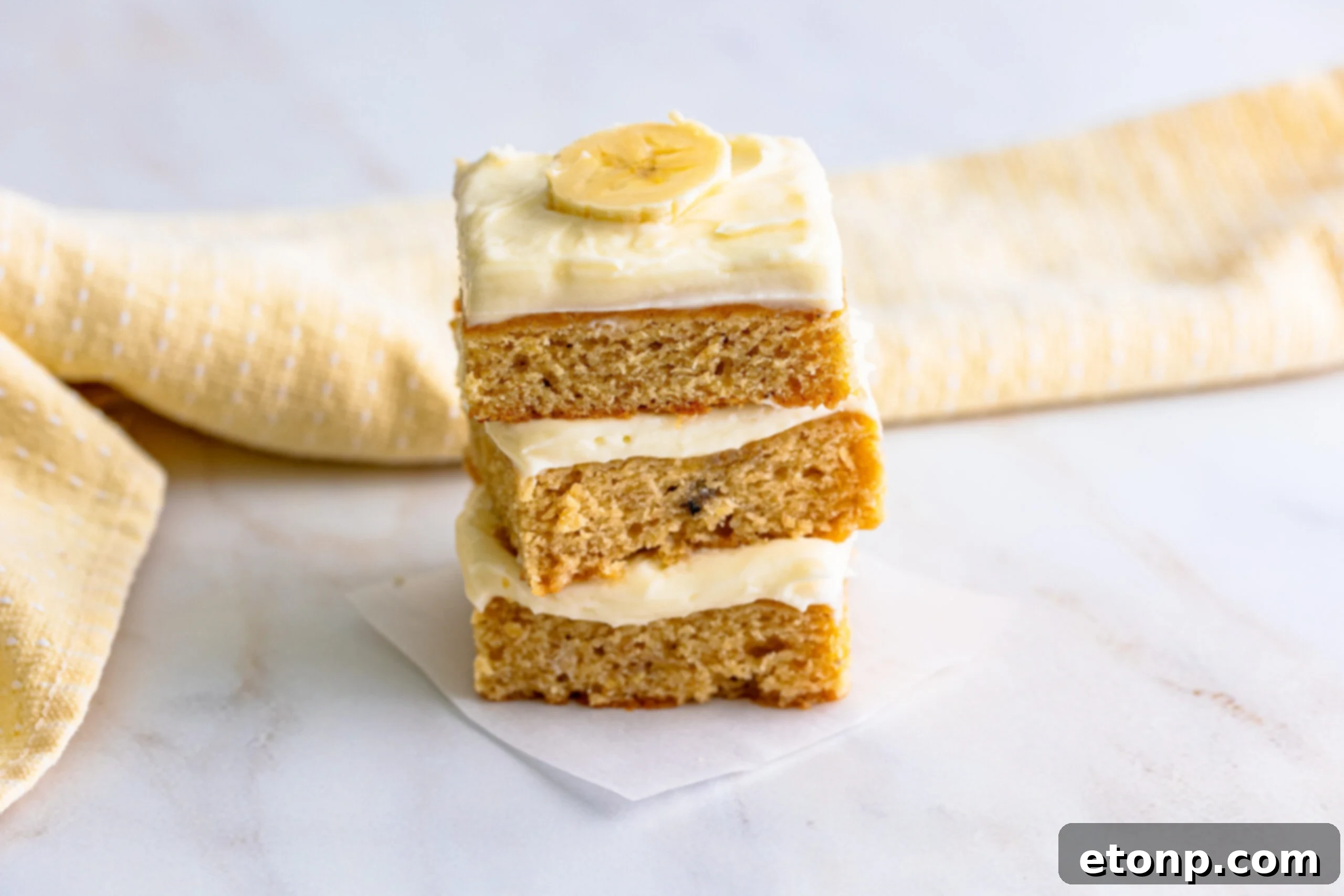 Ultimate Banana Brownies 9 Front view of three delightful Banana Brownies stacked together.