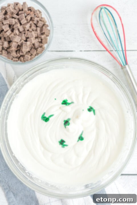 Step 4: Add green food coloring and gently stir.