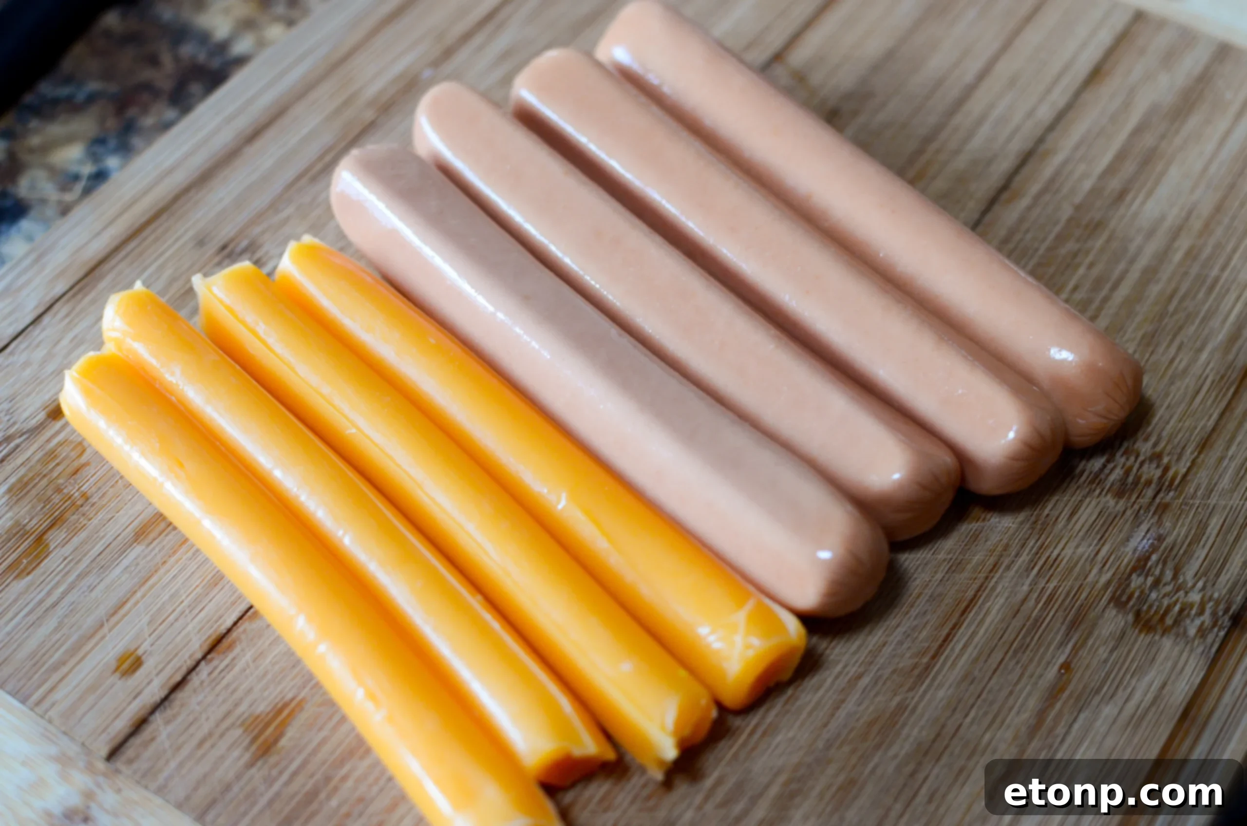Assembling the Chili Cheese Hot Dogs