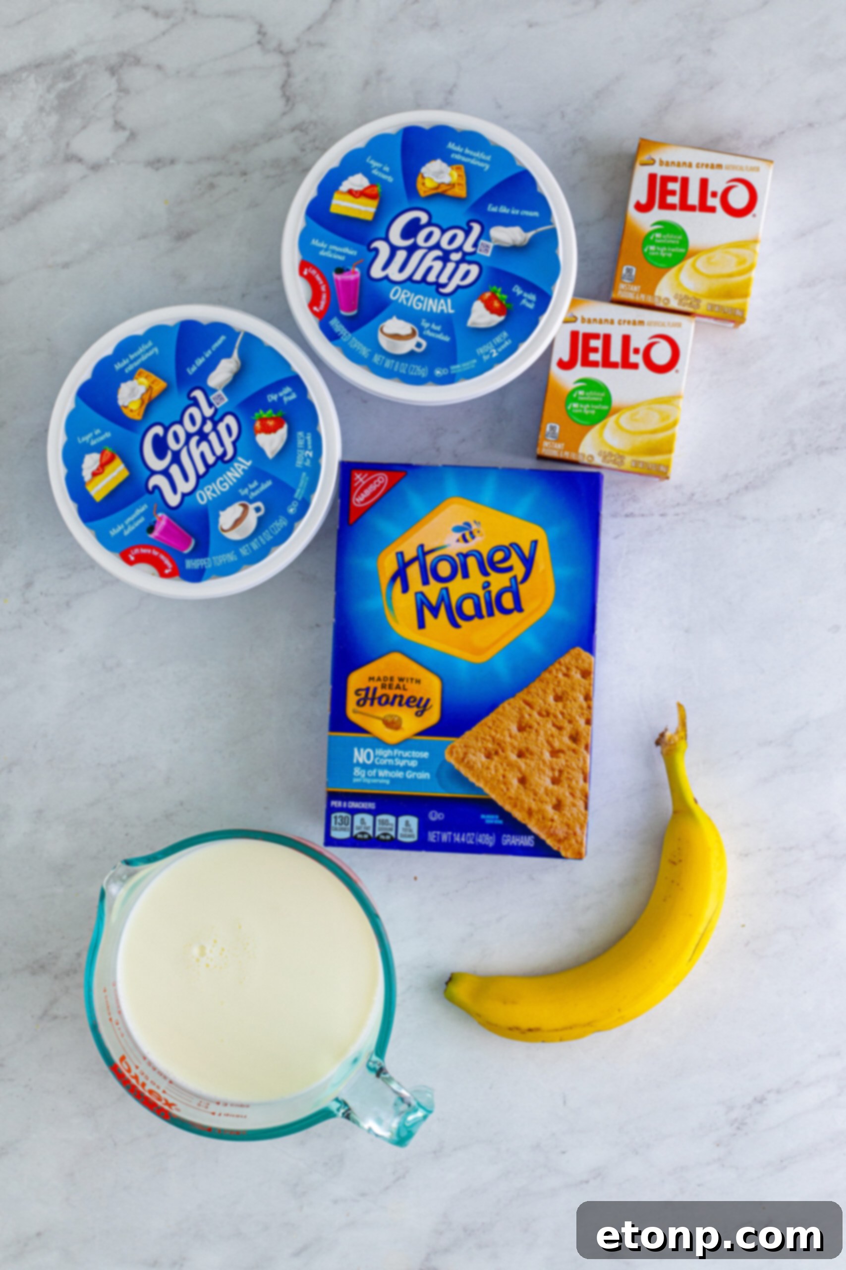 An overhead view captures all the simple ingredients laid out, ready for assembly to create this delicious Banana Icebox Cake.