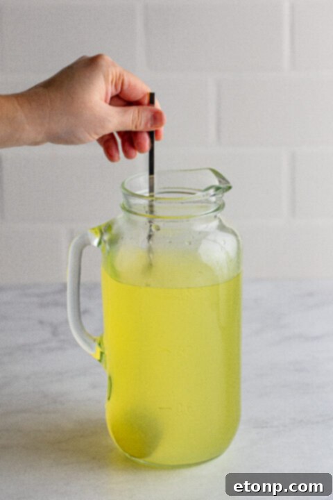 Simple syrup mixture, clear and ready for lemonade preparation.