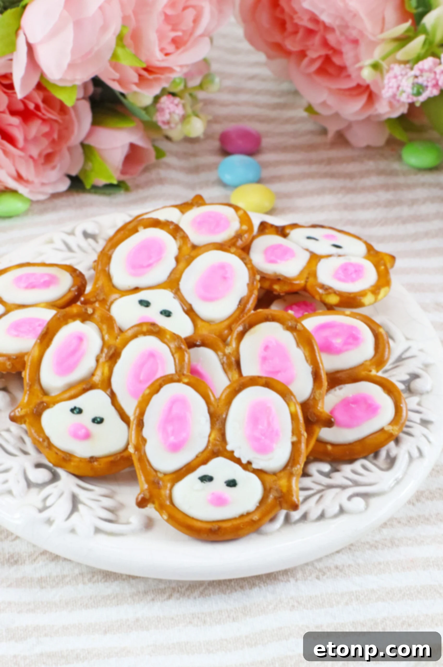 Front view of a pile of Bunny Pretzels on a white dish, showcasing their perfect snack size.