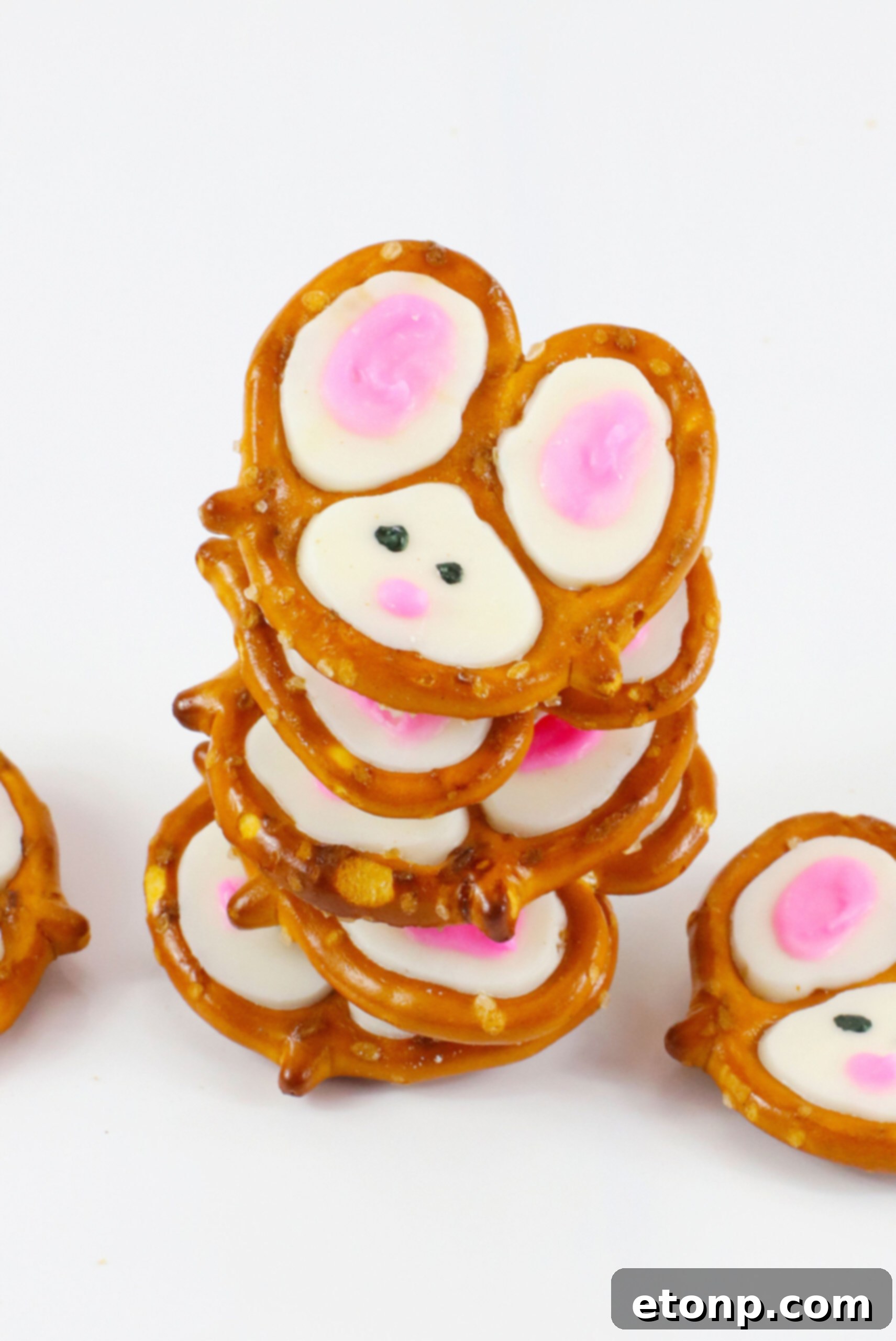 Overhead view of five Bunny Pretzels stacked artistically on a white background.
