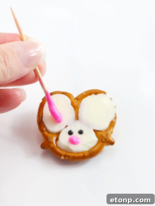 Several Bunny Pretzels neatly arranged on parchment paper.