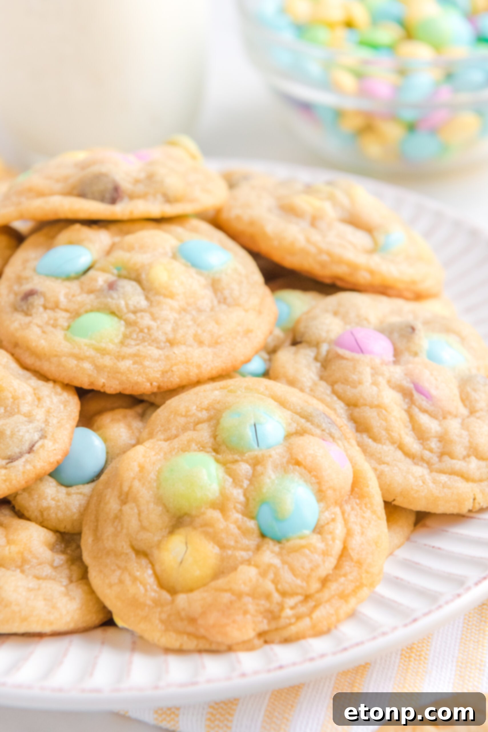 Close up view of a stack of Easter Pudding Cookies on a white plate.