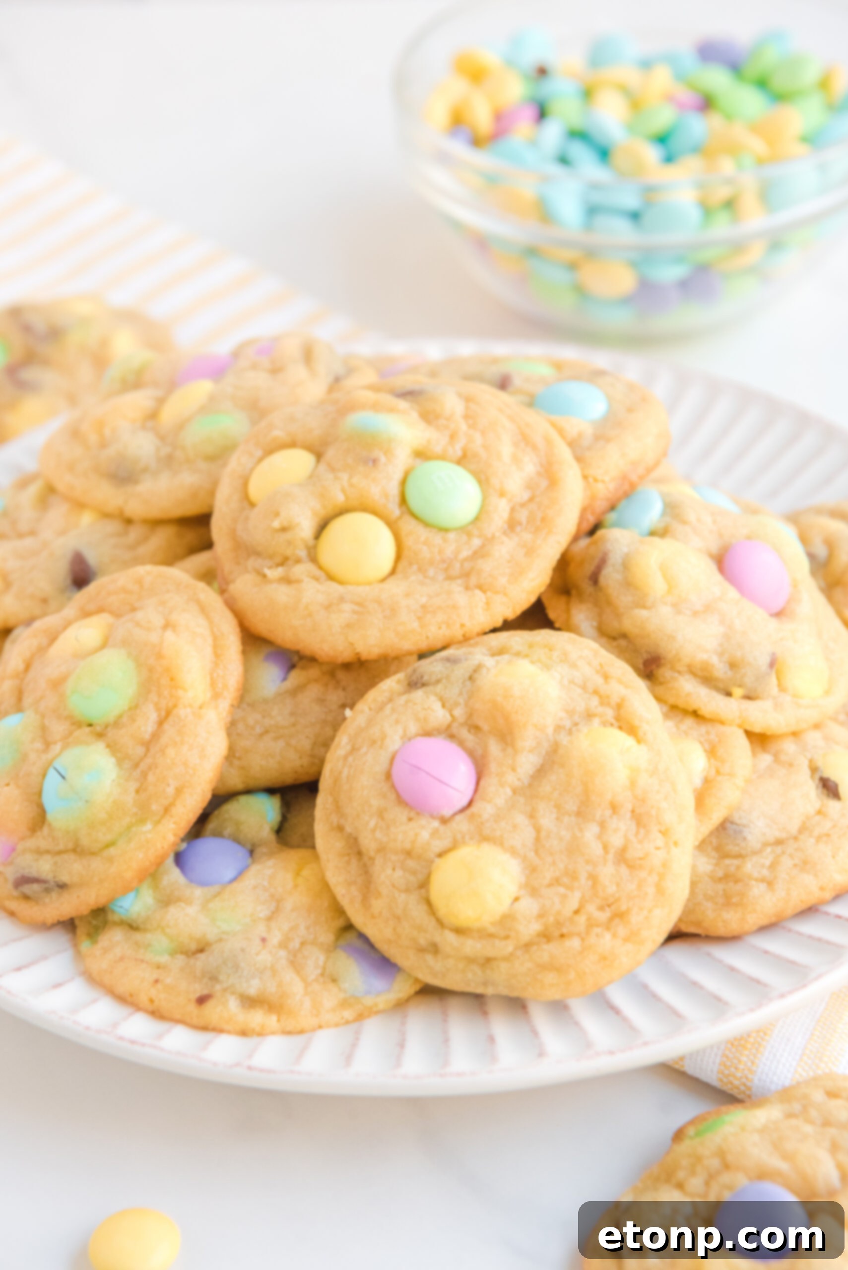 Front view of a stack of Easter Pudding Cookies on a white plate.