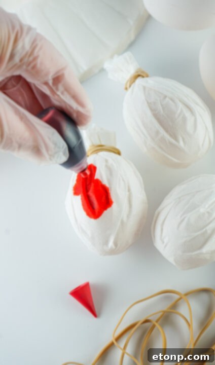 Step-by-step image of securing coffee filter with rubber band.