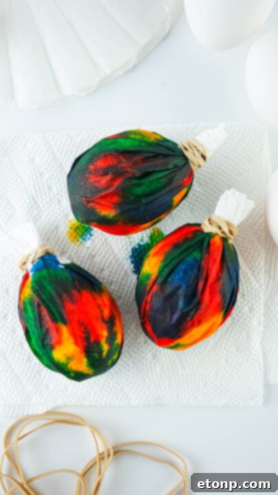 Step-by-step image of multiple colors applied to wrapped egg.