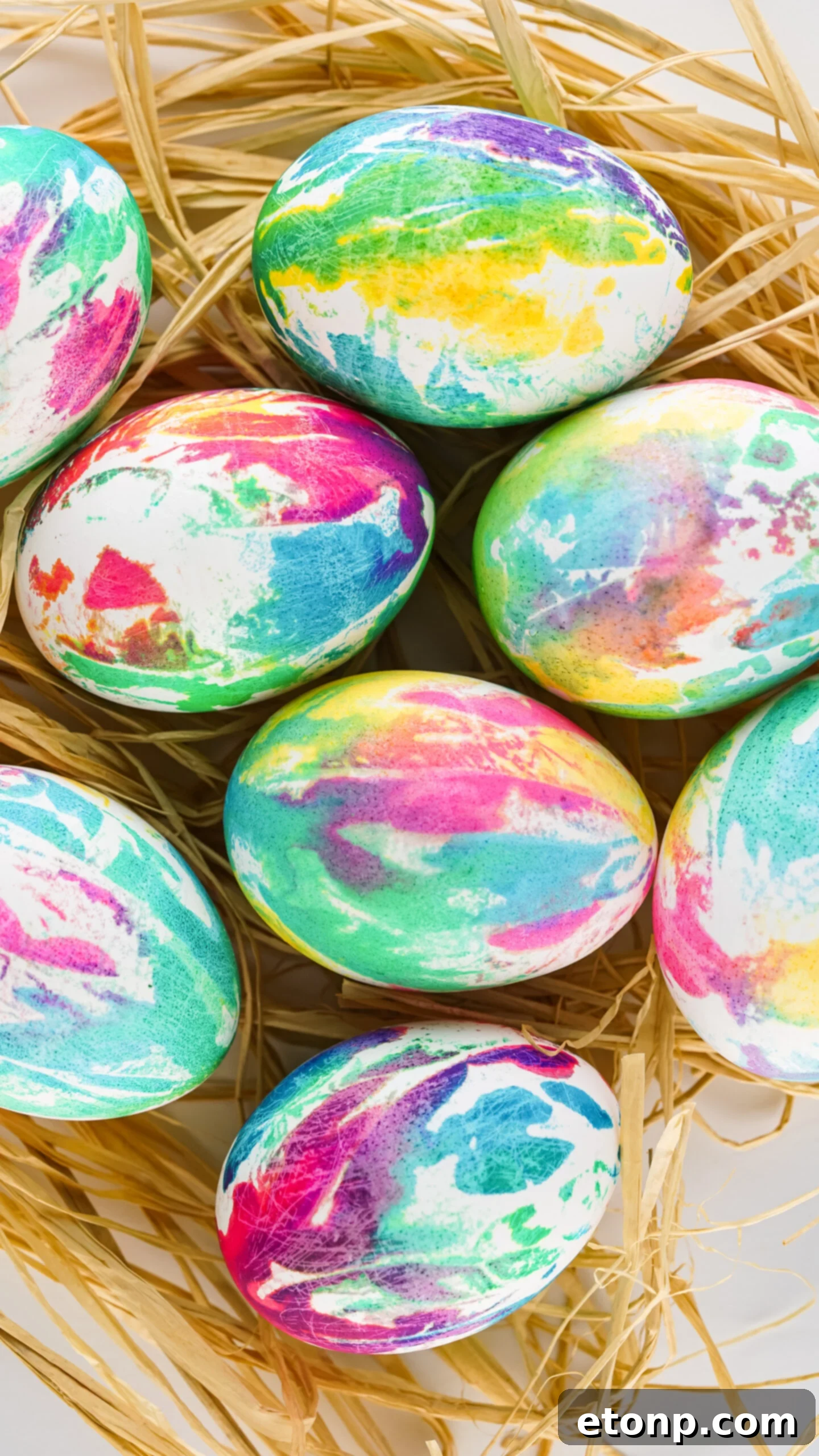 Overhead view of Tie Dye Easter Eggs on a bed of Easter grass.