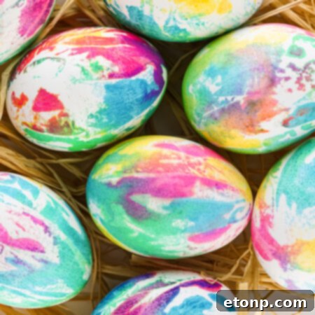 Overhead view of Tie Dye Easter Eggs on a bed of Easter grass.