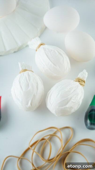 Step-by-step image of wrapping coffee filter around egg.