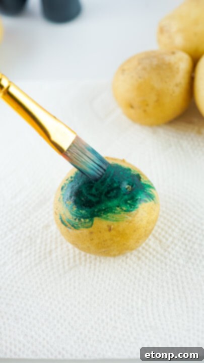 Step-by-step image of multiple colors being applied to a potato, demonstrating the blending effect.