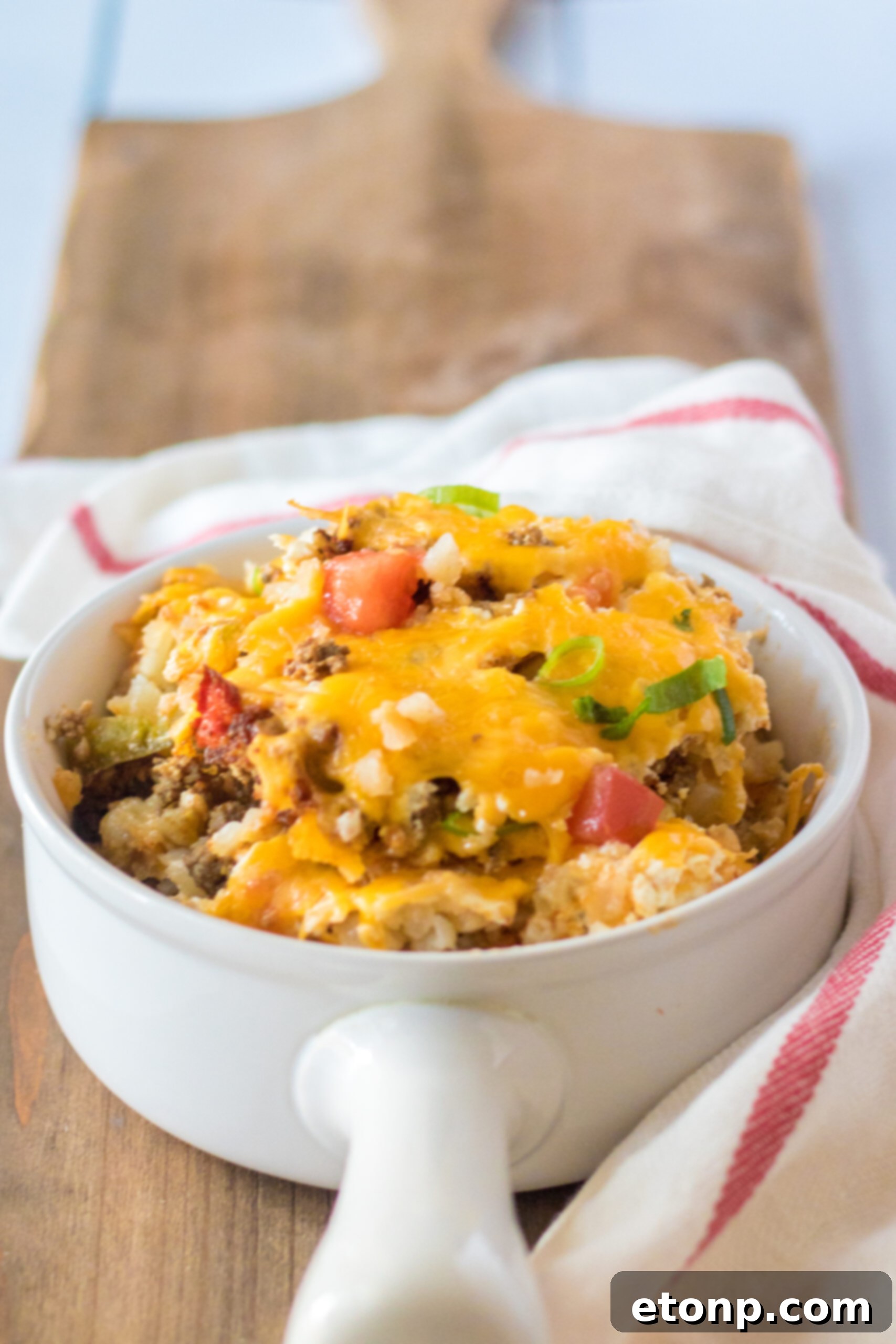 Front view of a serving of Slow Cooker John Wayne Casserole in a white bowl.