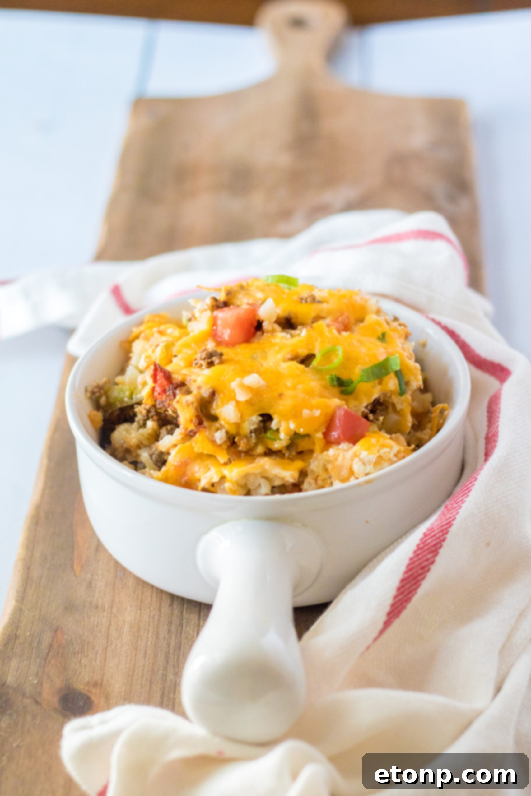 Front view of a serving of Slow Cooker John Wayne Casserole in a white bowl.