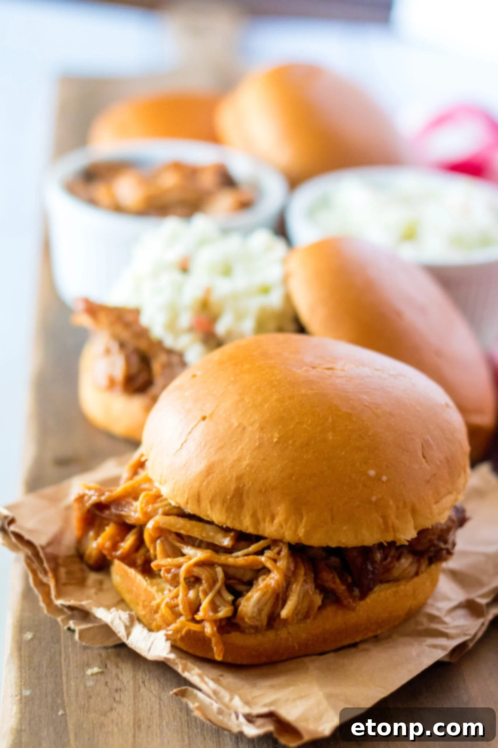 Front view of Slow Cooker Cola Pulled Pork on a bun.