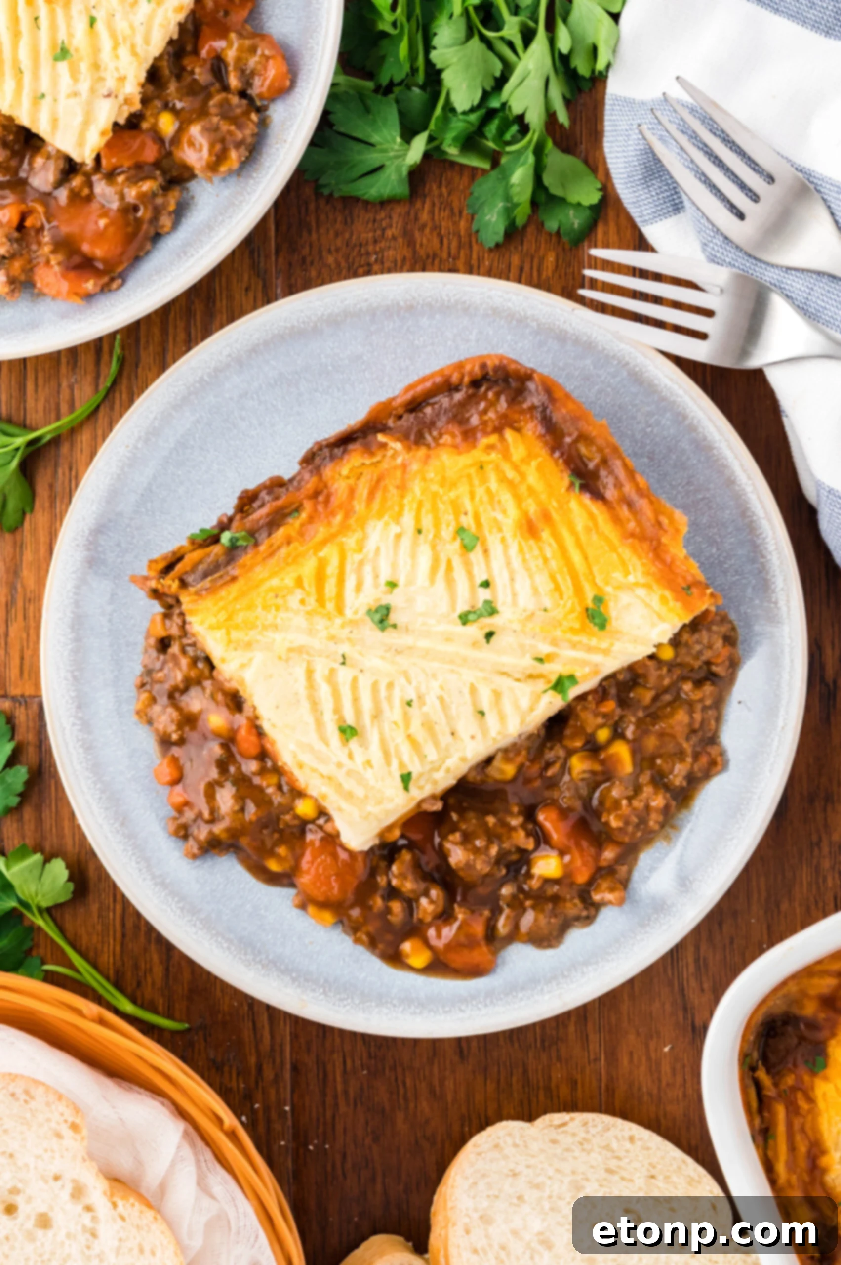 Overhead shot of Shepherd's Pie on a gray and white plate.