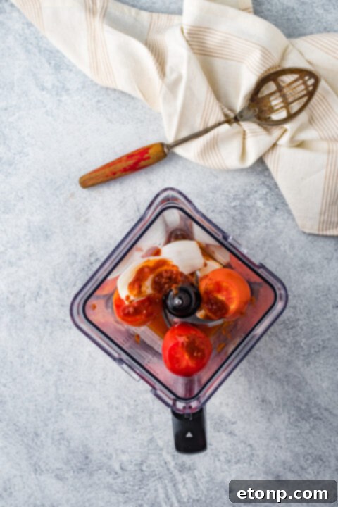 Crispy Tinga Taco with a dollop of Mexican crema.