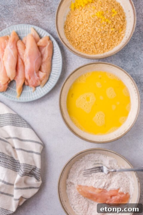 Step-by-step image of mixing buttermilk into biscuit dough to form a soft consistency.