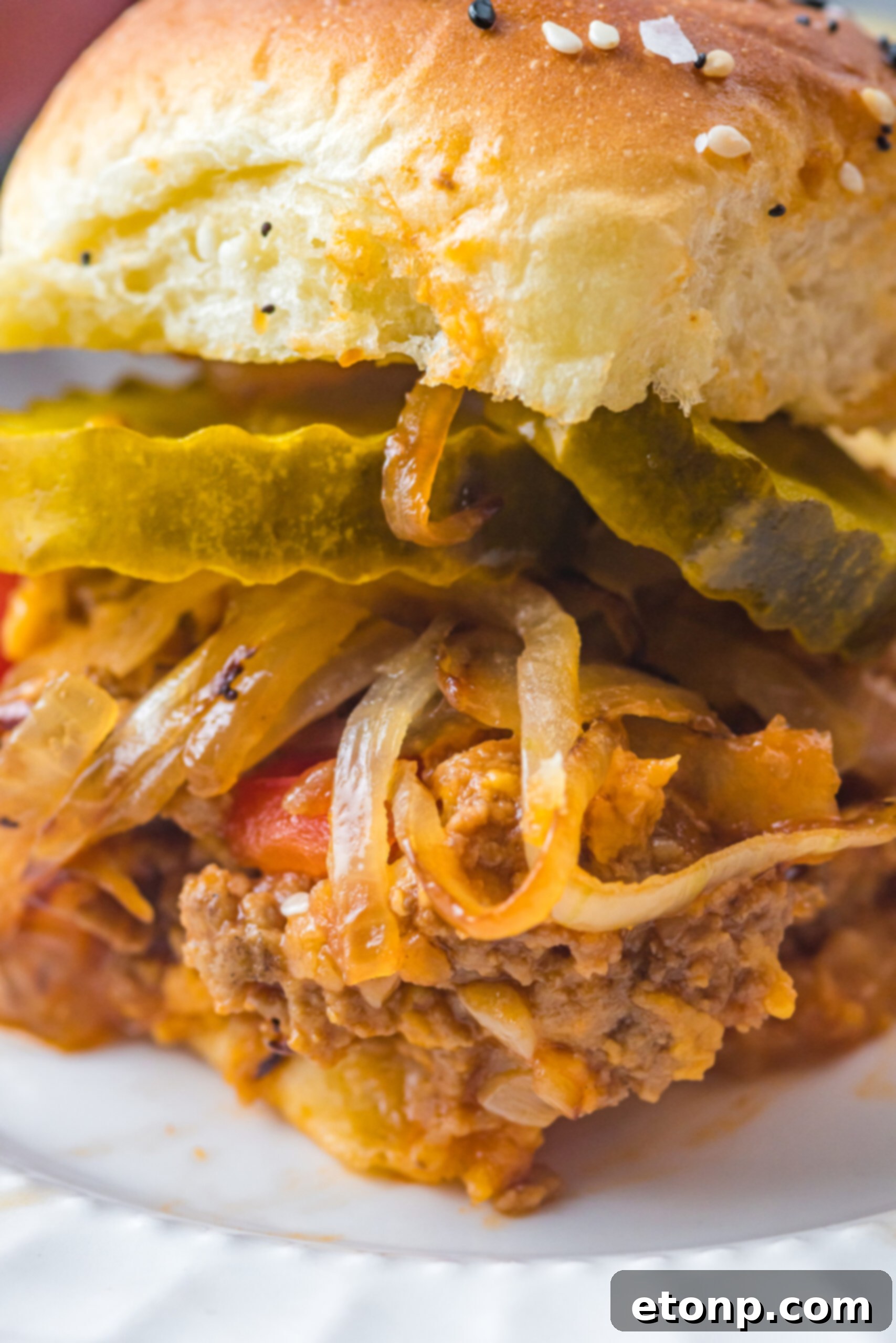 Close up view of a Cheesy Chicken Sloppy Joe Slider.
