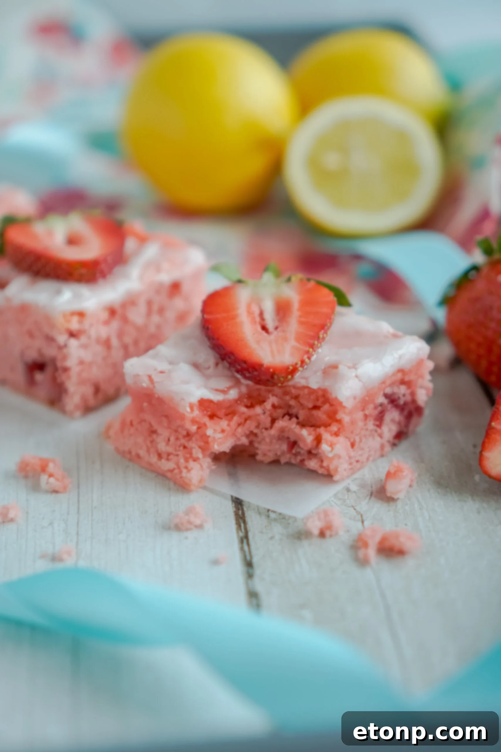 Front view of Strawberry Lemon Brownies on parchment paper.