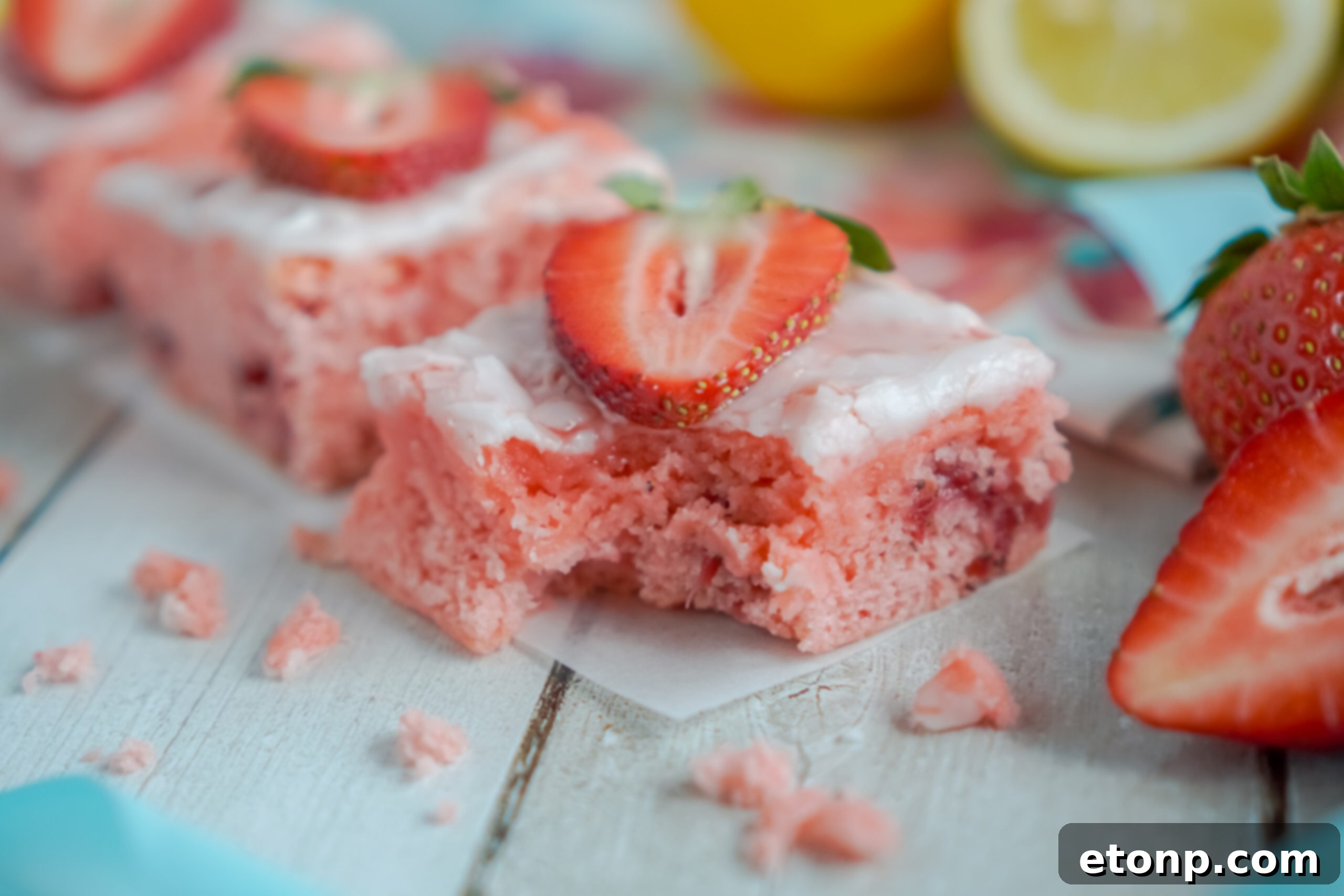 Strawberry Lemon Brownies side view with a bite removed