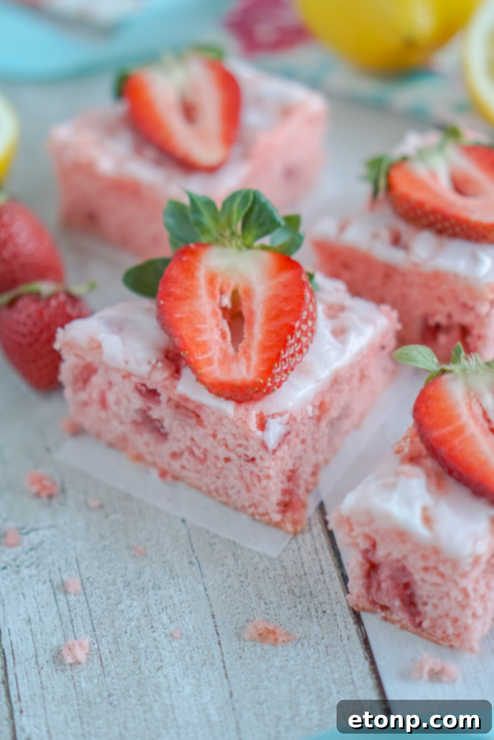 Front view of Strawberry Lemon Brownies on parchment paper.