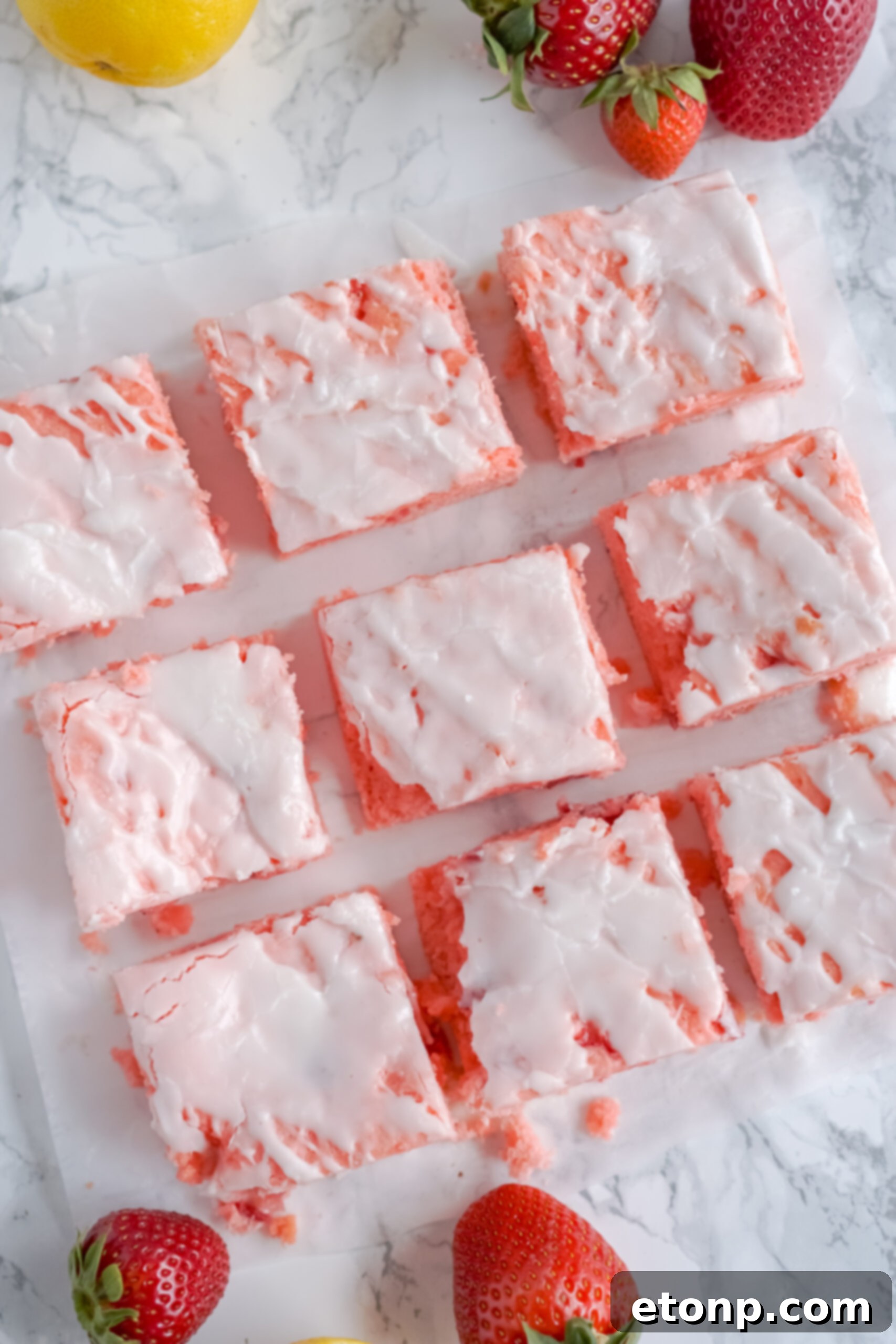 Overhead view of Strawberry Lemon Brownies on a piece of parchment paper.