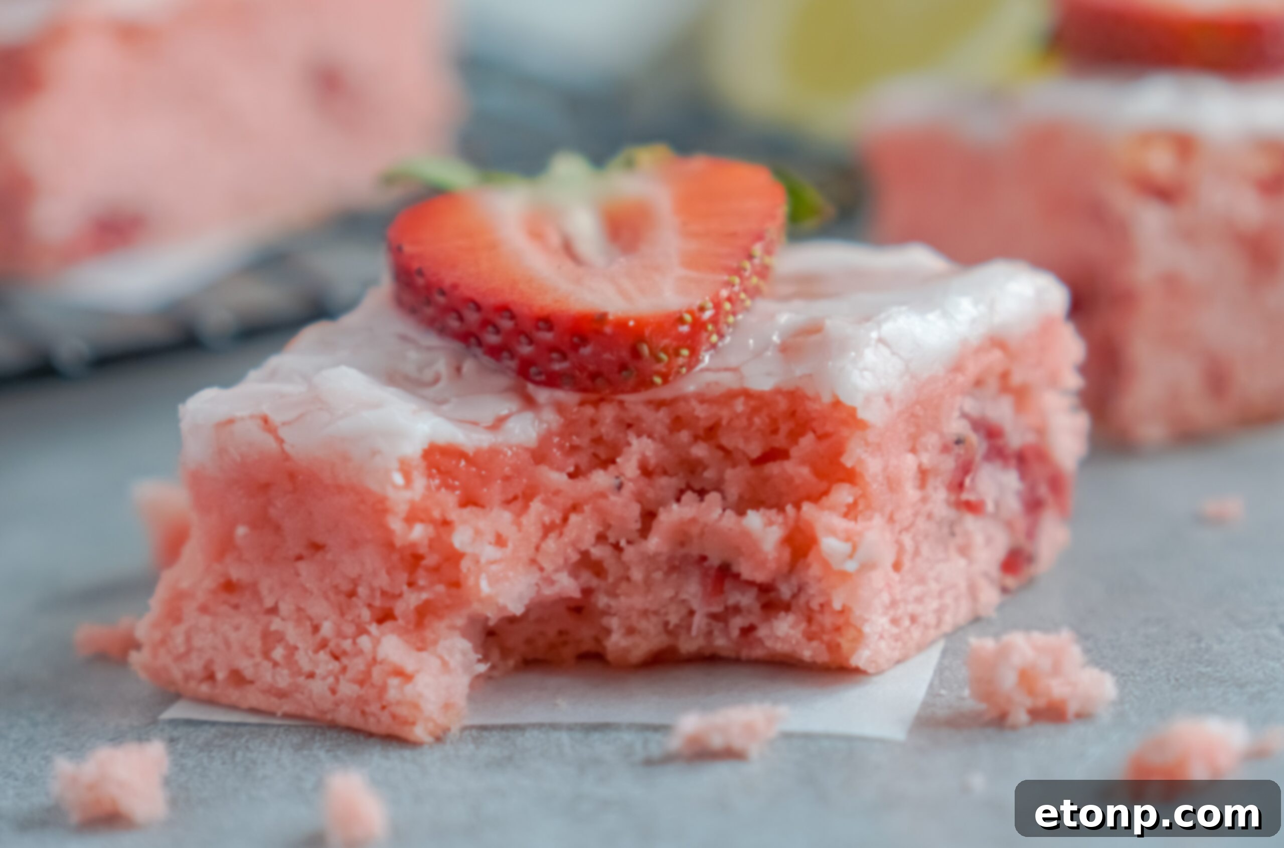 Front view of a Strawberry Lemon Brownie with a bite missing