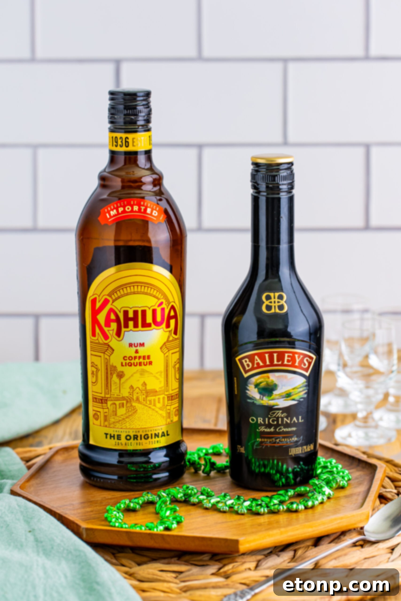 The two essential ingredients, Kahlua and Bailey's Irish Cream, neatly arranged on a countertop, ready to be transformed into Baby Guinness Shots.