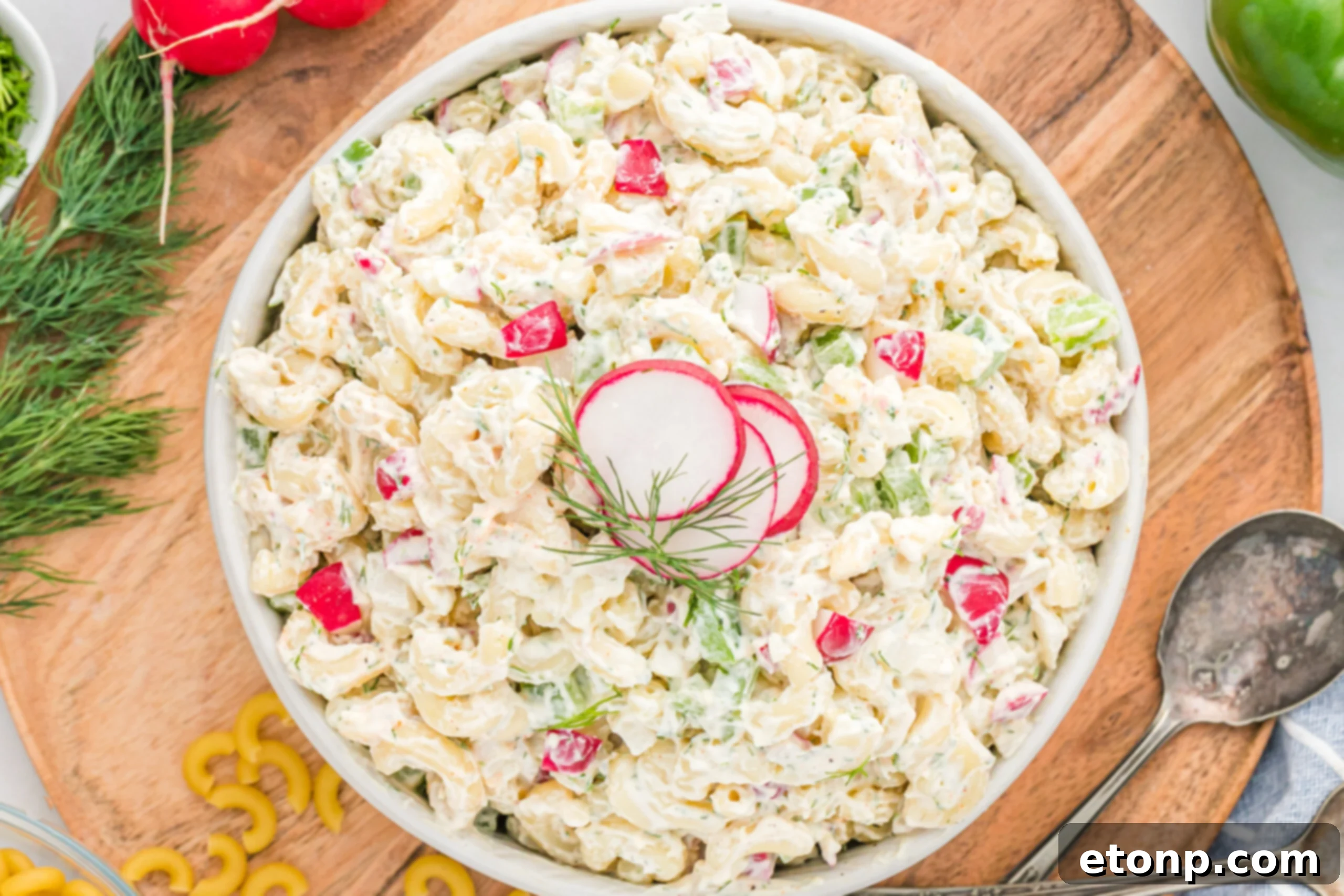Creamy Dill Macaroni Salad 3 Overhead view of Macaroni Dill Pasta Salad in a pristine white serving bowl, ready to be enjoyed.