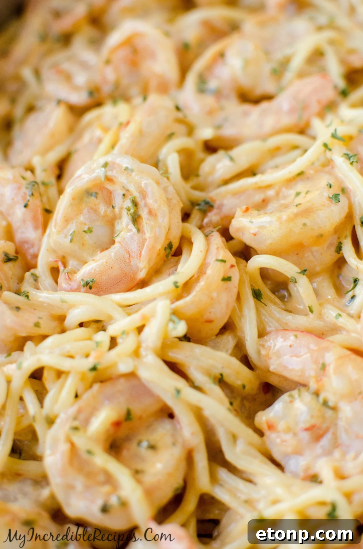 Overhead view of Bang Bang Shrimp Pasta with fresh parsley.