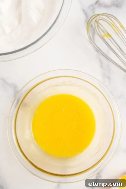 Progress shot of the lemon meringue pie making process.