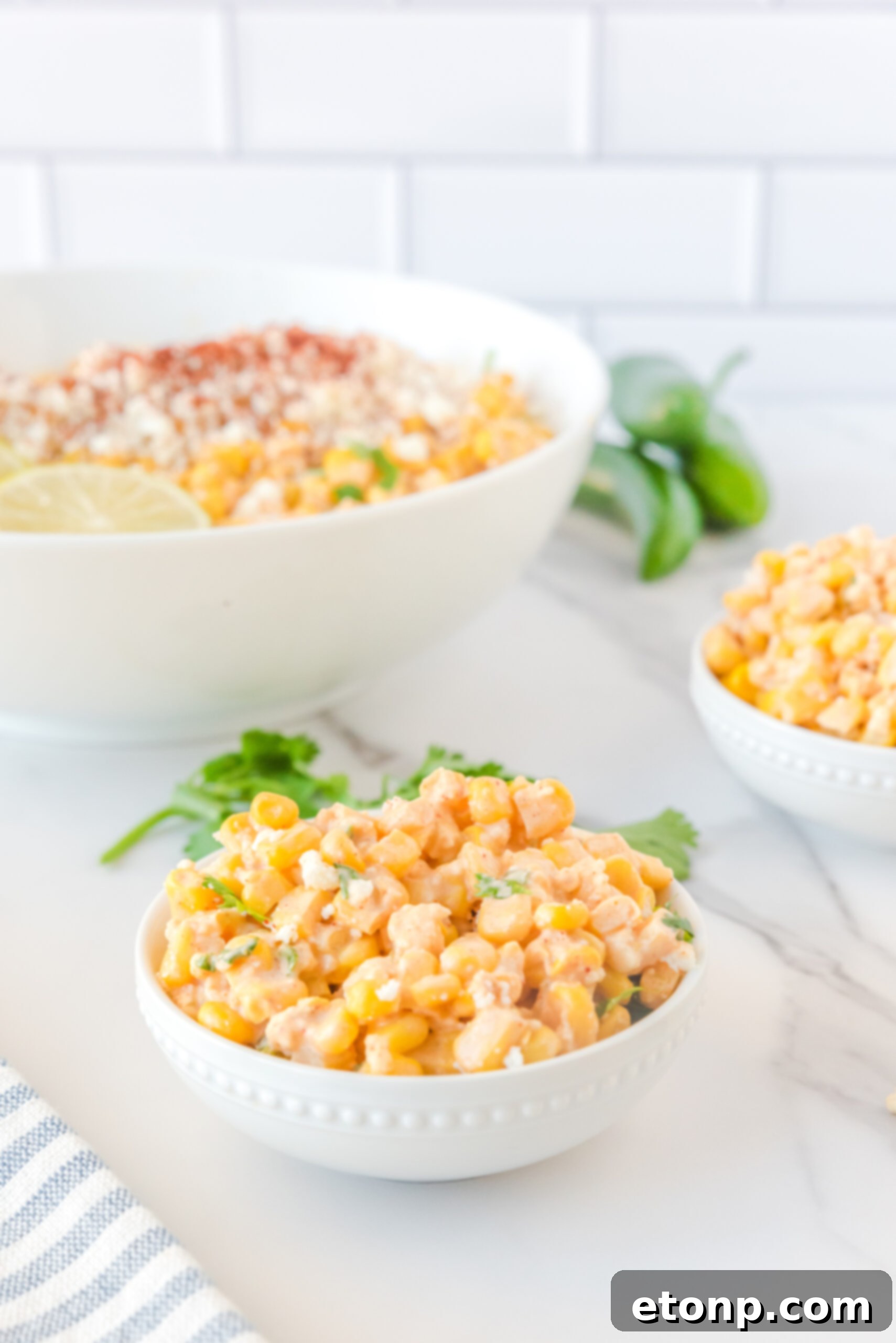 Mexican Street Corn Salad beautifully arranged in a small white serving bowl, ready for individual enjoyment.