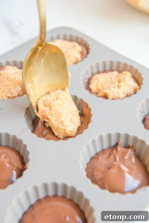 Homemade Peanut Butter Chocolate Cups 11 Finished peanut butter cups nestled in a silicone mold, chilling in the refrigerator.