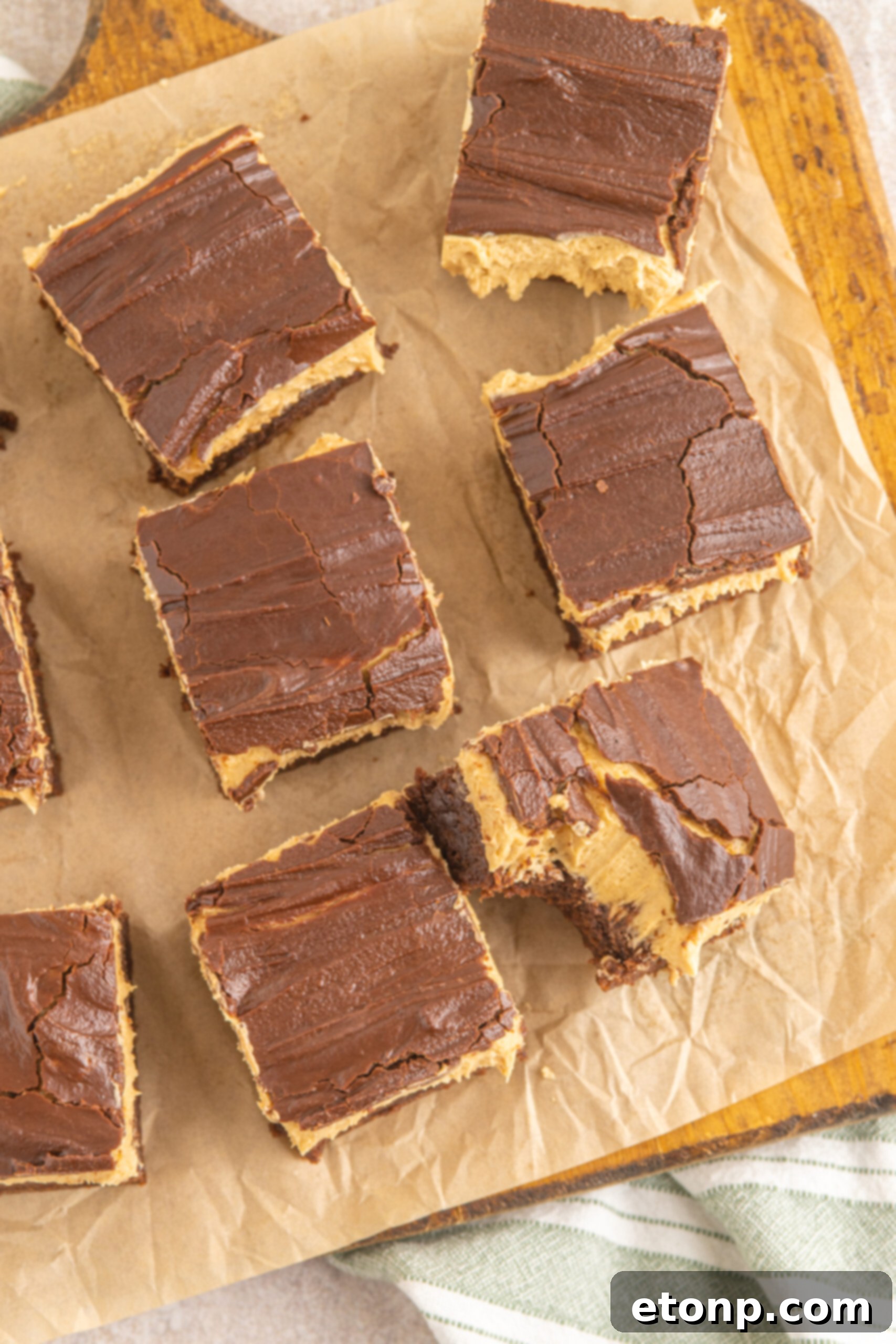 Overhead shot of Buckeye Brownies on a wooden serving board with parchment paper.