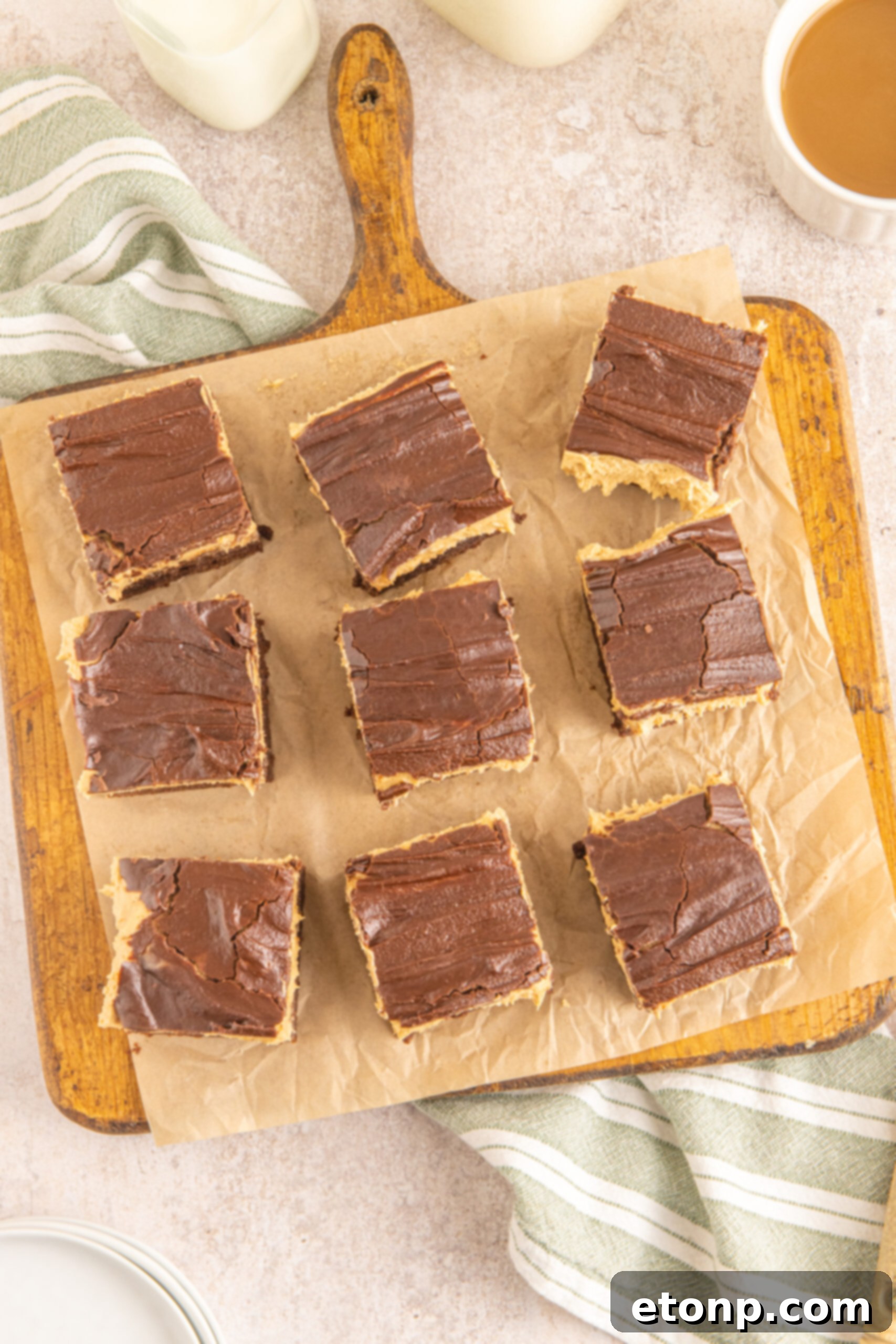 Overhead shot of Buckeye Brownies on a wooden serving board with parchment paper.