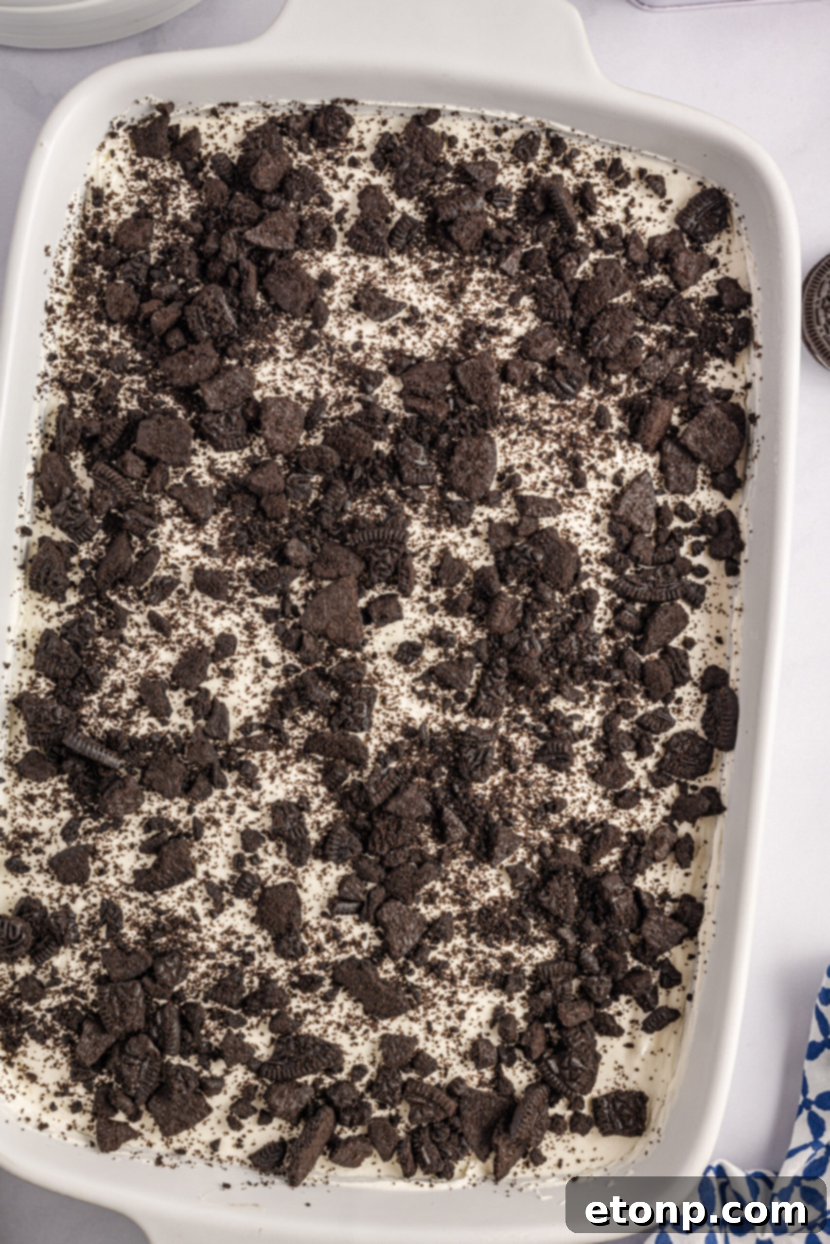 Oreo Cream Dream 5 Overhead view of Oreo Icebox Cake in a white baking dish.
