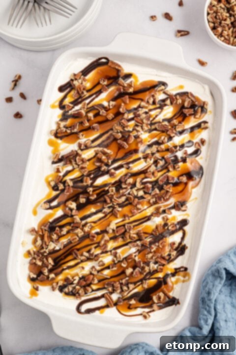 Adding chopped pecans to the cream cheese layer.